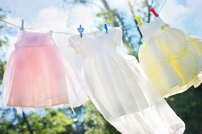 If you want to get baby poo stains out of baby clothes it's best to dryy them in the sun than use a dryer
