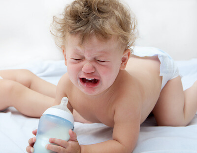 Baby refusing shop bottle while teething